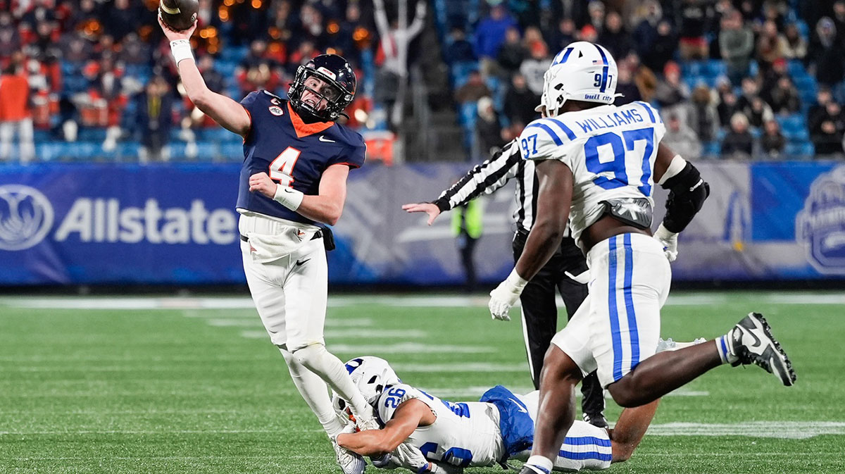 Virginia Cavaliers quarterback Chandler Morris (4) is sacked by Duke Blue Devils safety Ma'khi Jones (26) in the second half during the 2025 ACC Championship game at Bank of America Stadium.