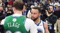 Warriors guard Stephen Curry (30) and Dallas Mavericks forward Cooper Flagg (center left) greet each other after the game at Chase Center