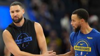 Mavericks guard Klay Thompson (left) greets Golden State Warriors guard Stephen Curry (right) before the game at Chase Center