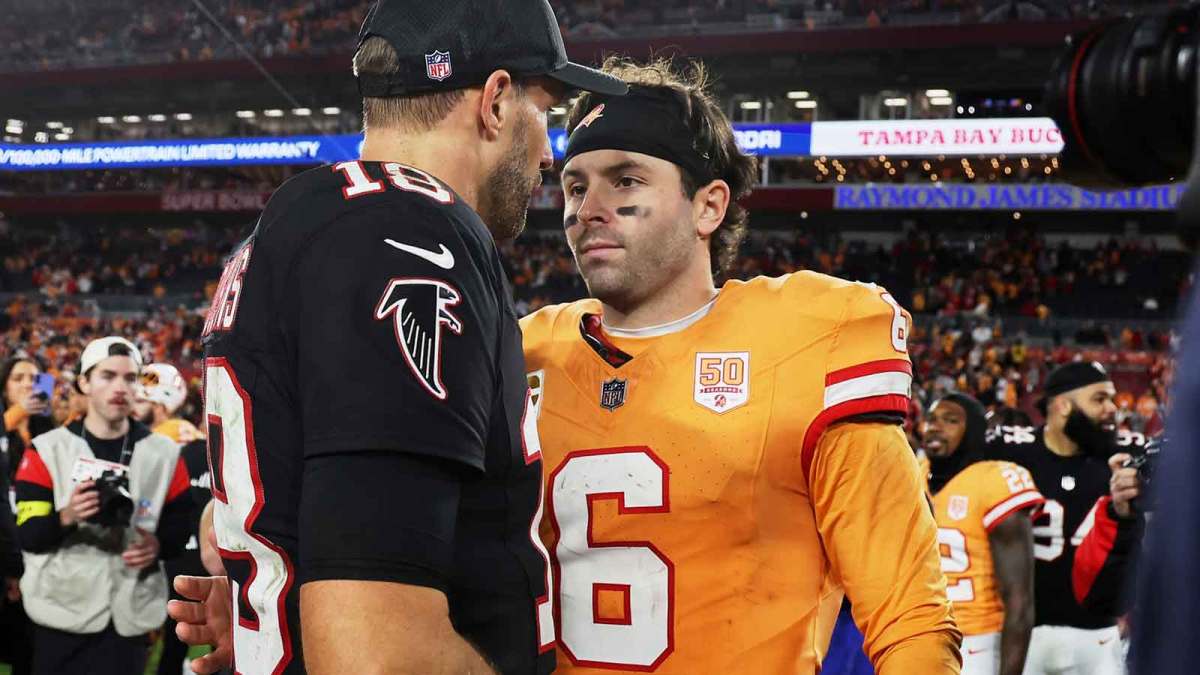Atlanta Falcons quarterback Kirk Cousins (18) greets Tampa Bay Buccaneers quarterback Baker Mayfield (6) on the field after the game at Raymond James Stadium.