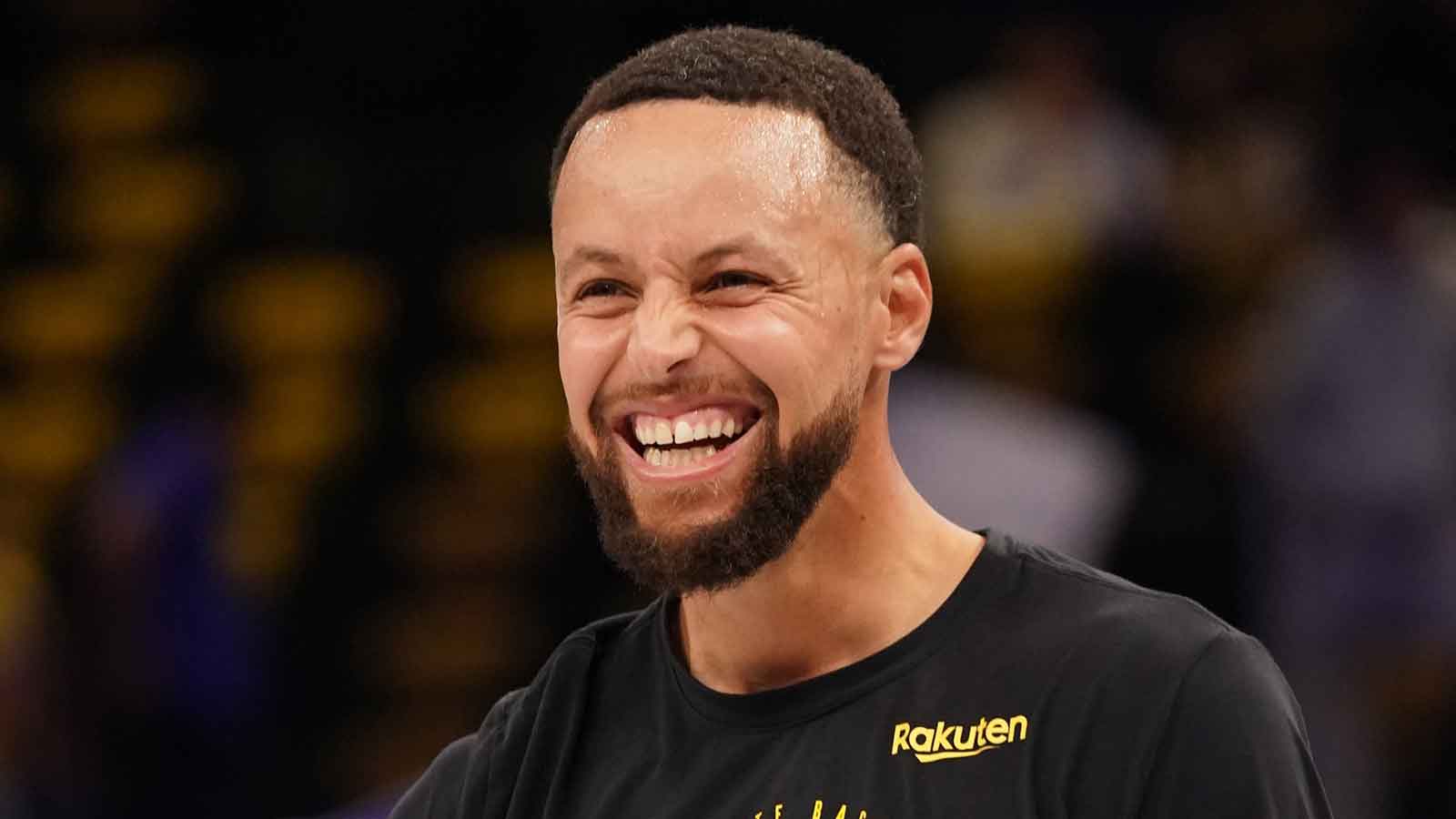 Golden State Warriors guard Stephen Curry (30) laughs during warm ups before the game against the Houston Rockets at Chase Center.
