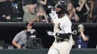 Chicago White Sox outfielder Luis Robert Jr. (88) gestures after he hits a home run during the eighth inning against the Minnesota Twins at Rate Field.