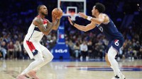 Washington Wizards forward Cam Whitmore (1) shoots the ball against Philadelphia 76ers guard Jared McCain (20) in the second quarter at Xfinity Mobile Arena.