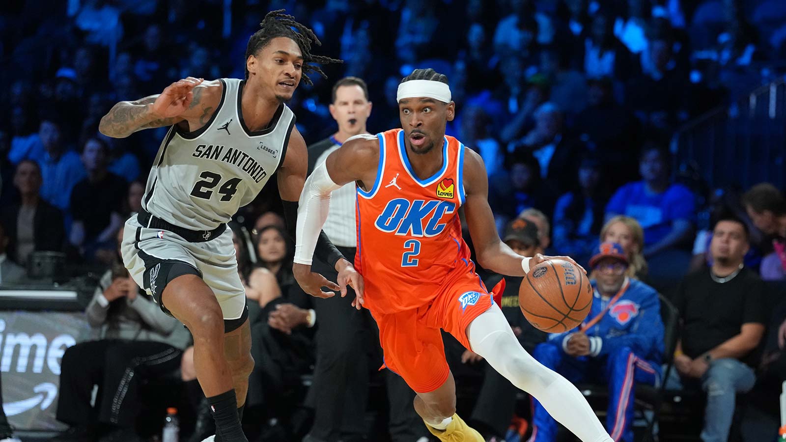 Oklahoma City Thunder guard Shai Gilgeous-Alexander (2) works around San Antonio Spurs guard Devin Vassell (24) during the first quarter at T-Mobile Arena.
