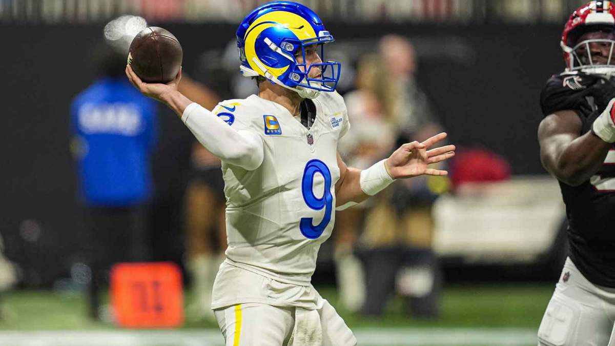Los Angeles Rams quarterback Matthew Stafford (9) throws an interception to Atlanta Falcons safety Jessie Bates III (3) (not shown) during the first half at Mercedes-Benz Stadium.