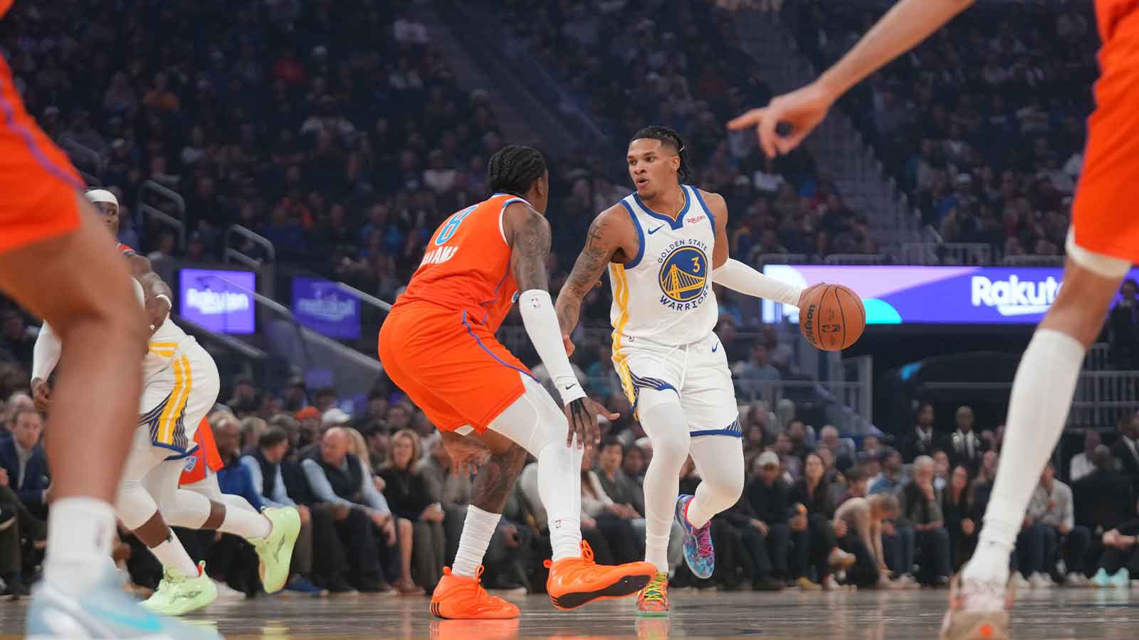 Golden State Warriors guard Will Richard (3) dribbles the ball next to Oklahoma City Thunder guard Jalen Williams (8) in the first quarter at the Chase Center.