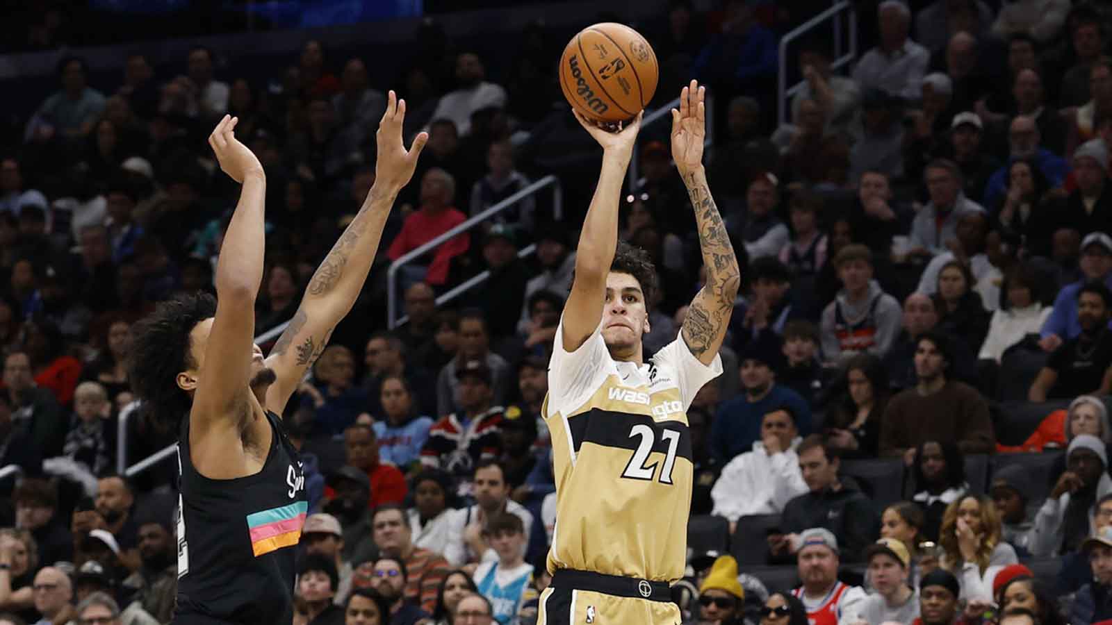 Washington Wizards guard Will Riley (27) shoots the ball as San Antonio Spurs guard Dylan Harper (2) defends in the second half at Capital One Arena.