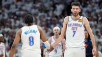 Oklahoma City Thunder forward Chet Holmgren (7) reacts with forward Jalen Williams (8) in the second half during game four of the western conference finals for the 2025 NBA Playoffs at Target Center.