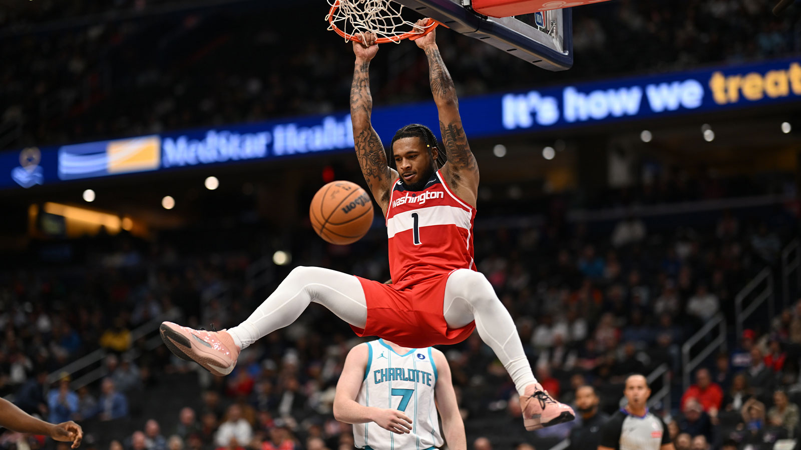 Washington Wizards forward Cam Whitmore (1) dunks the ball against the Charlotte Hornets during the second quarter at Capital One Arena.