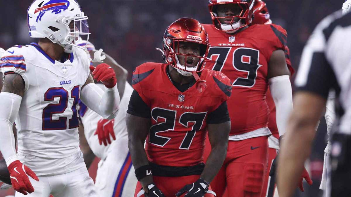 Houston Texans running back Woody Marks (27) reacts after running for a first down during the game against the Buffalo Bills at NRG Stadium.