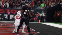 Houston Texans running back Woody Marks (27) celebrates a touchdown during the first quarter against the Arizona Cardinals at NRG Stadium.