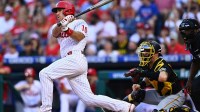 Philadelphia Phillies catcher JT Realmuto (10) hits an RBI double against the Pittsburgh Pirates in the first inning at Citizens Bank Park.