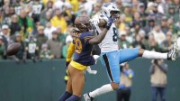 Green Bay Packers safety Xavier McKinney (29) defends against Carolina Panthers tight end Tommy Tremble (82) in the fourth quarter during their football game at Lambeau Field.