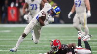 Los Angeles Rams wide receiver Xavier Smith (19) is tackled by Atlanta Falcons cornerback Dee Alford (20) after a catch in the second quarter at Mercedes-Benz Stadium.