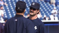 Former New York Yankees great Don Mattingly talks with manager Joe Torre during the 2003 Yankees Spring Training