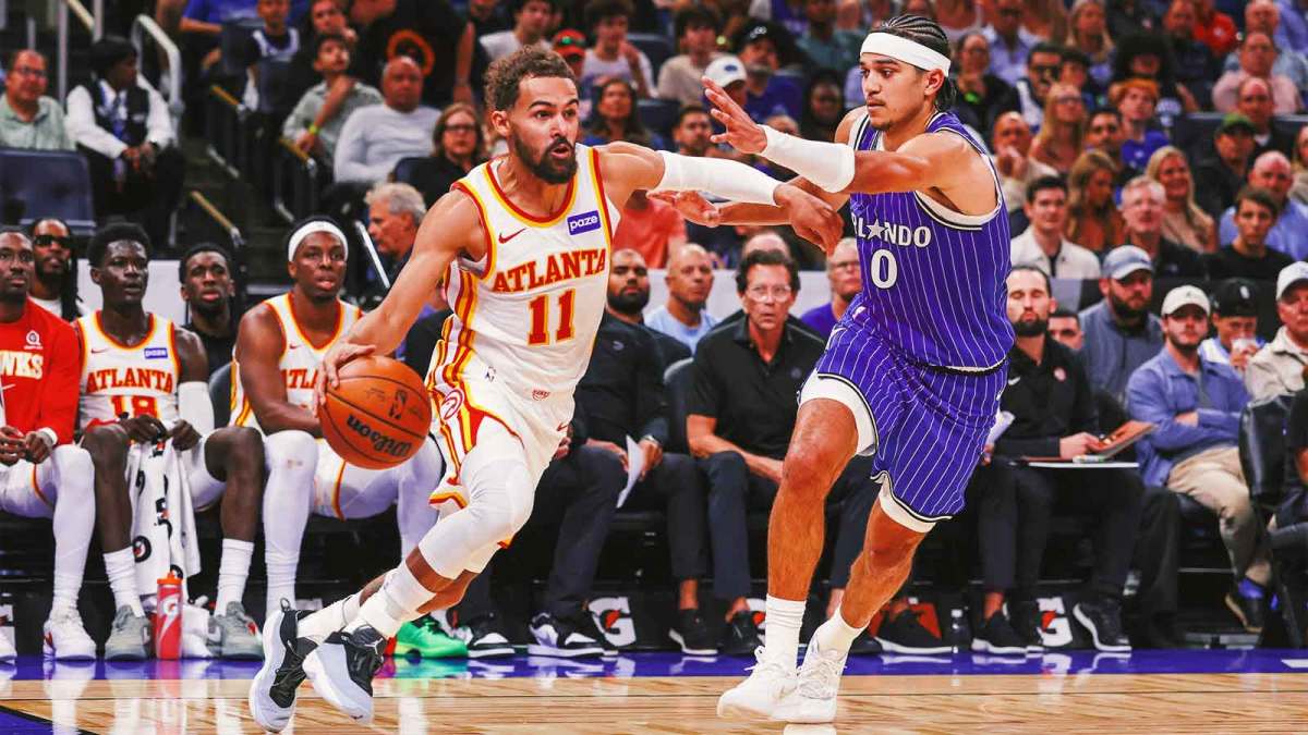 Atlanta Hawks guard Trae Young (11) drives around Orlando Magic guard Anthony Black (0) during the second quarter at Kia Center.