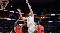 Memphis Grizzlies center Zach Edey (14) shoots against New Orleans Pelicans center Derik Queen (22) during the first half at Smoothie King Center.