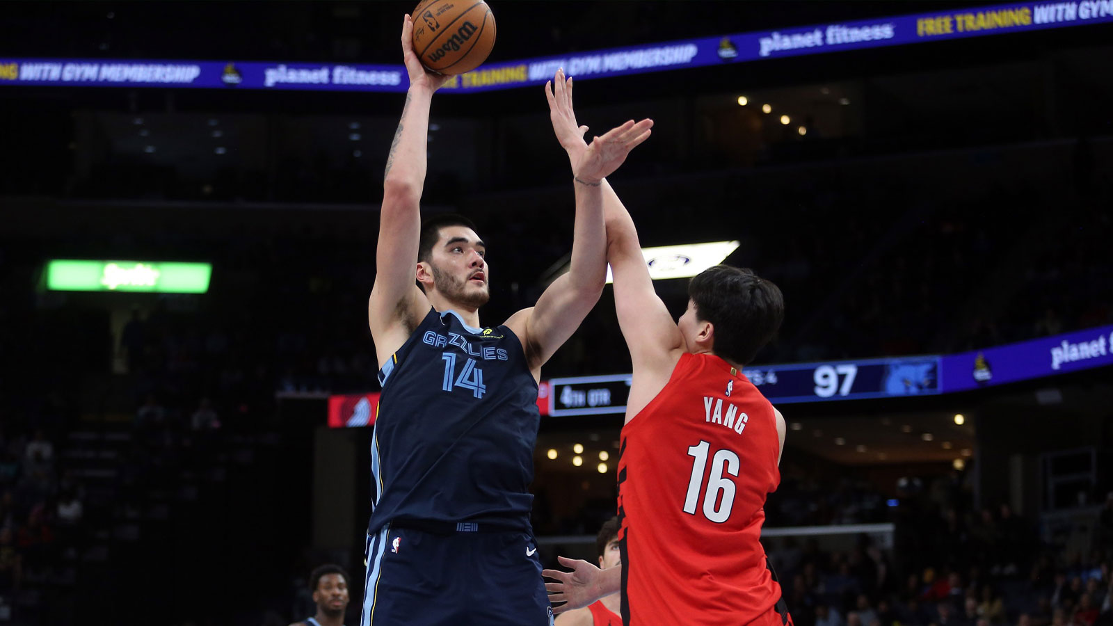 Memphis Grizzlies center Zach Edey (14) shoots as Portland Trail Blazers center Yang Hansen (16) defends during the fourth quarter at FedExForum.