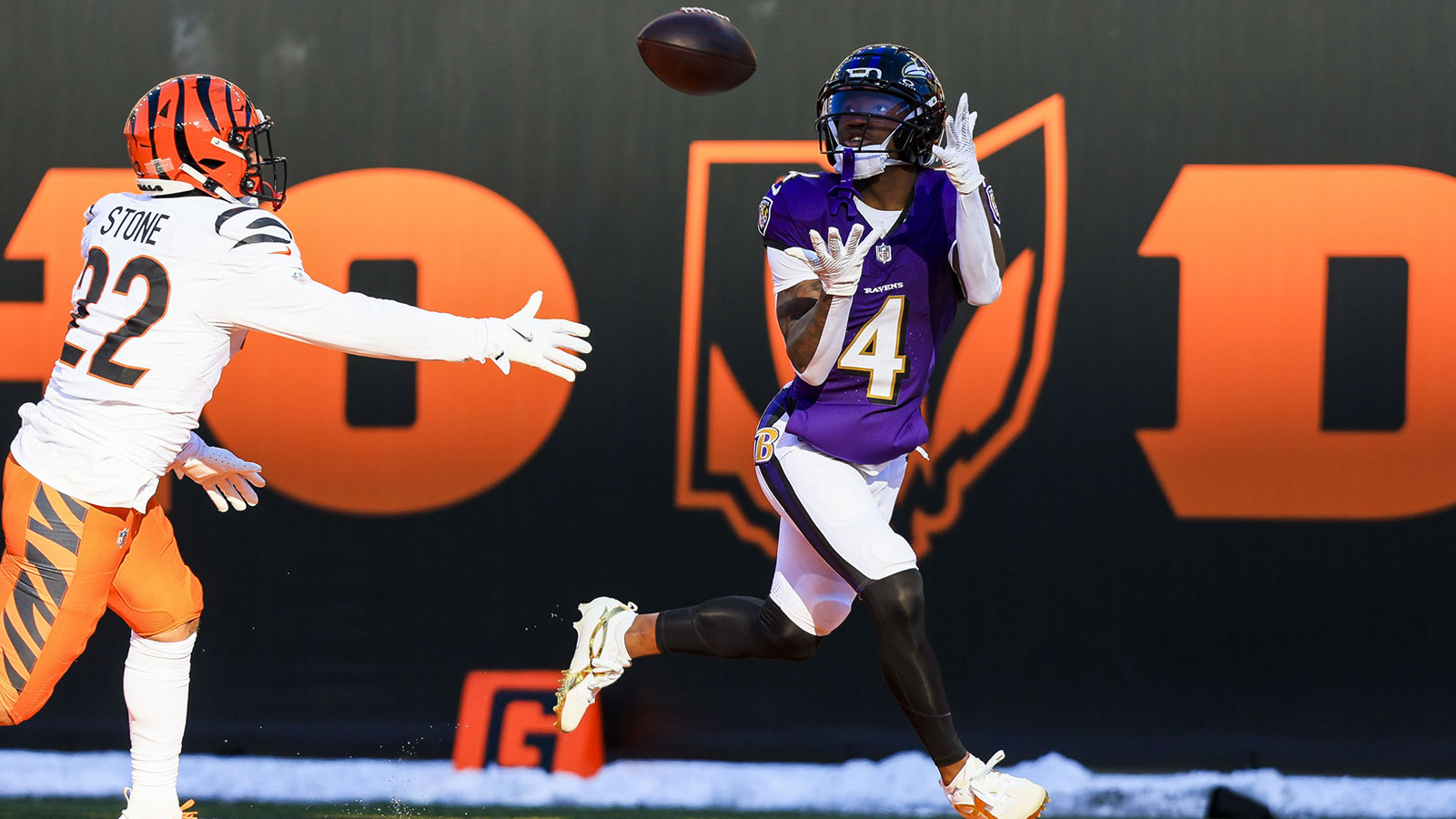 Baltimore Ravens wide receiver Zay Flowers (4) catches a pass for a touchdown in the first half against Cincinnati Bengals safety Geno Stone (22) at Paycor Stadium.