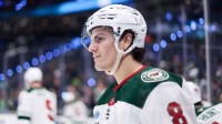 Minnesota Wild defenseman Zeev Buium (8) looks on during warm ups before the game against Seattle Kraken at Climate Pledge Arena.