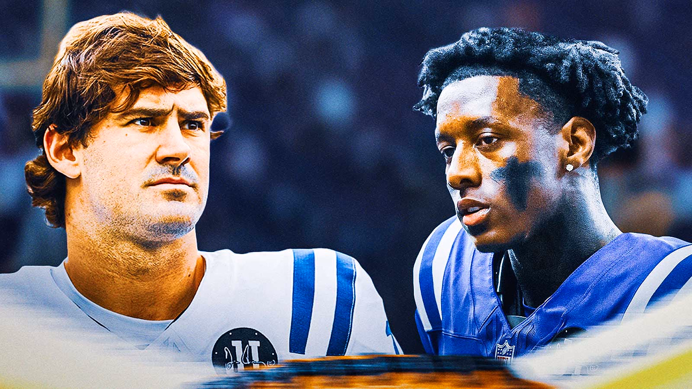 Daniel Jones and Sauce Gardner beside each other, Crying fans in the background