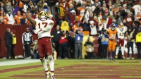 Washington Commanders wide receiver Terry McLaurin (17) celebrates after catching a touchdown pass against the Denver Broncos during overtime at Northwest Stadium.