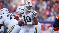 Green Bay Packers quarterback Jordan Love (10) runs in the pocket during the second quarter against the Denver Broncos at Empower Field at Mile High.