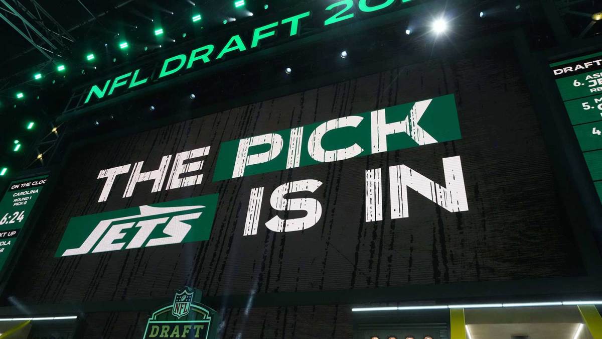 The New York Jets logo is projected on the video board during the NFL Draft at Lambeau Field.
