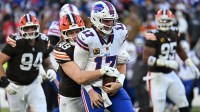 Buffalo Bills quarterback Josh Allen (17) is sacked by Cleveland Browns linebacker Carson Schwesinger (49) during the second half at Huntington Bank Field.