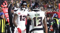 Houston Texans wide receiver Christian Kirk (13) celebrates a touchdown with wide receiver Nico Collins (12) against the Pittsburgh Steelers during the first half of an AFC Wild Card Round game at Acrisure Stadium.