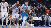Charlotte Hornets guard Kon Knueppel (7) drives to the basket past Oklahoma City Thunder guard Aaron Wiggins (21) during the second half at Paycom Center.
