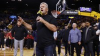 Michigan Wolverines football head coach Kyle Whittingham speaks to the crowd during a time out in the first half against the Southern California Trojans at Crisler Center.
