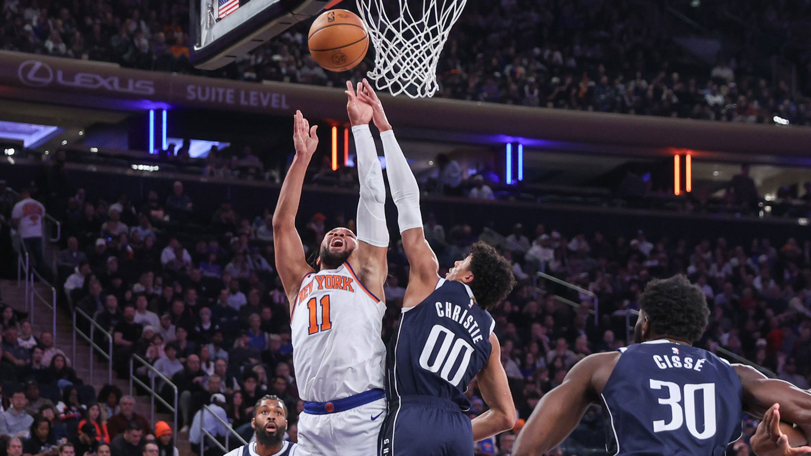 New York Knicks guard Jalen Brunson (11) drives past Dallas Mavericks guard Max Christie (00) in the first quarter at Madison Square Garden.