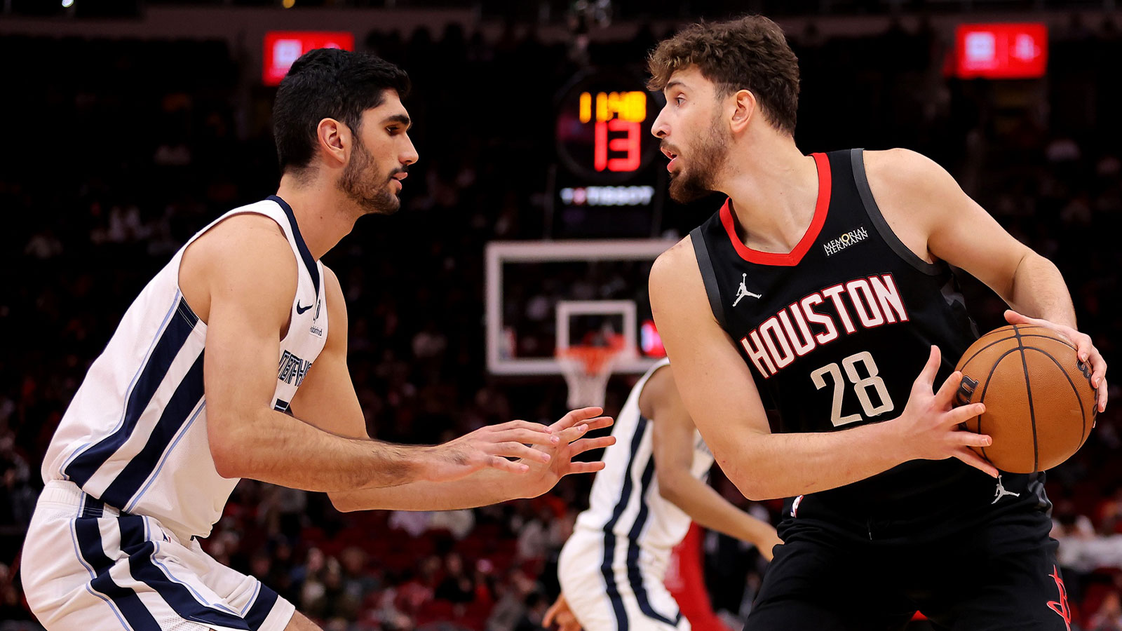 Houston Rockets center Alperen Sengun (28) handles the ball against Memphis Grizzlies forward Santi Aldama (7) during the first quarter at Toyota Center.