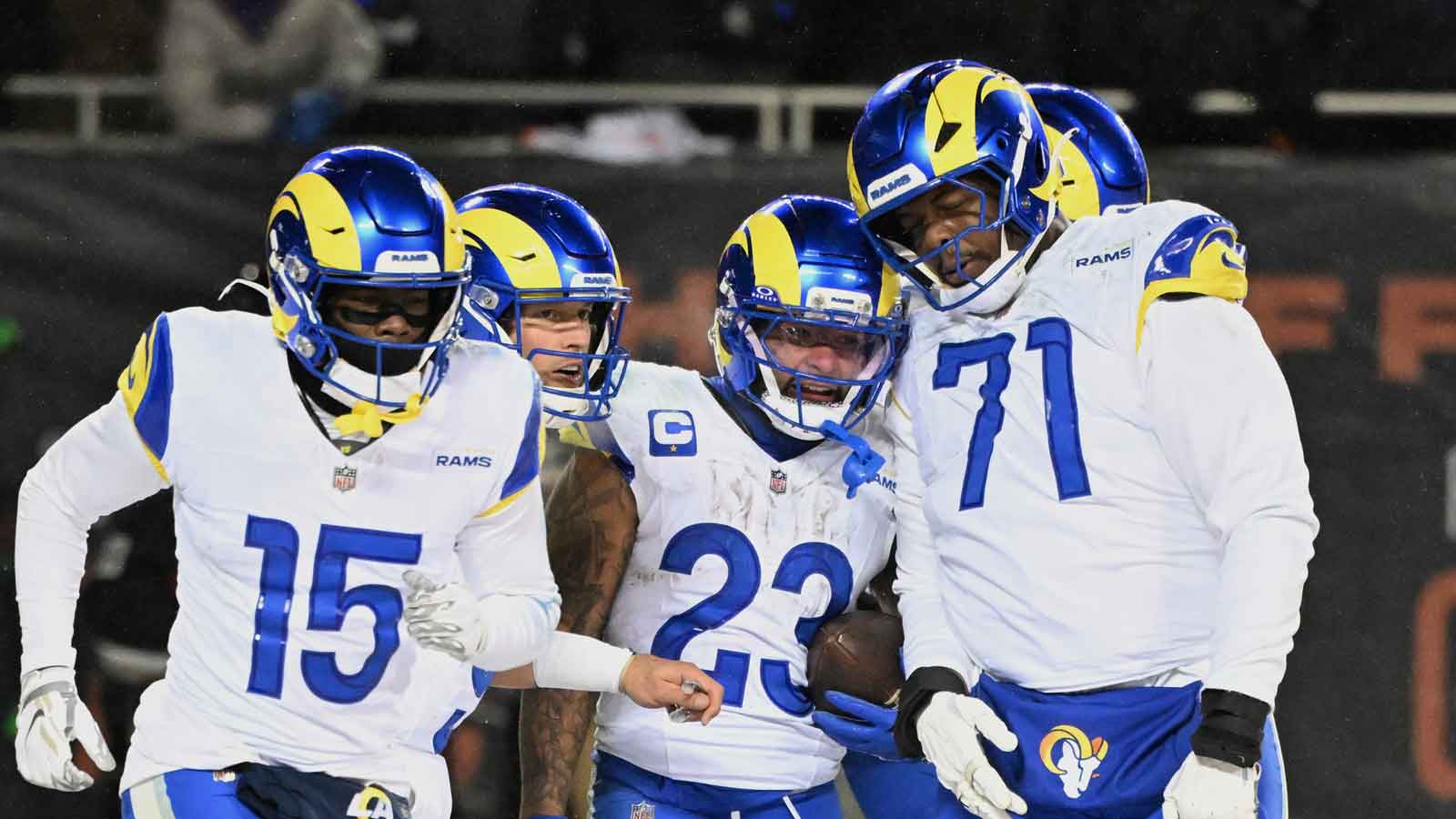 Los Angeles Rams running back Kyren Williams (23) celebrates with center Coleman Shelton (65) after scoring a touchdown against the Chicago Bears during the fourth quarter of an NFC Divisional Round game at Soldier Field.