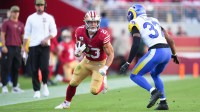 San Francisco 49ers running back Christian McCaffrey (23) runs the ball against Los Angeles Rams safety Quentin Lake (37) during the second quarter at Levi's Stadium