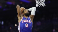 76ers forward Paul George (8) dunks the ball
