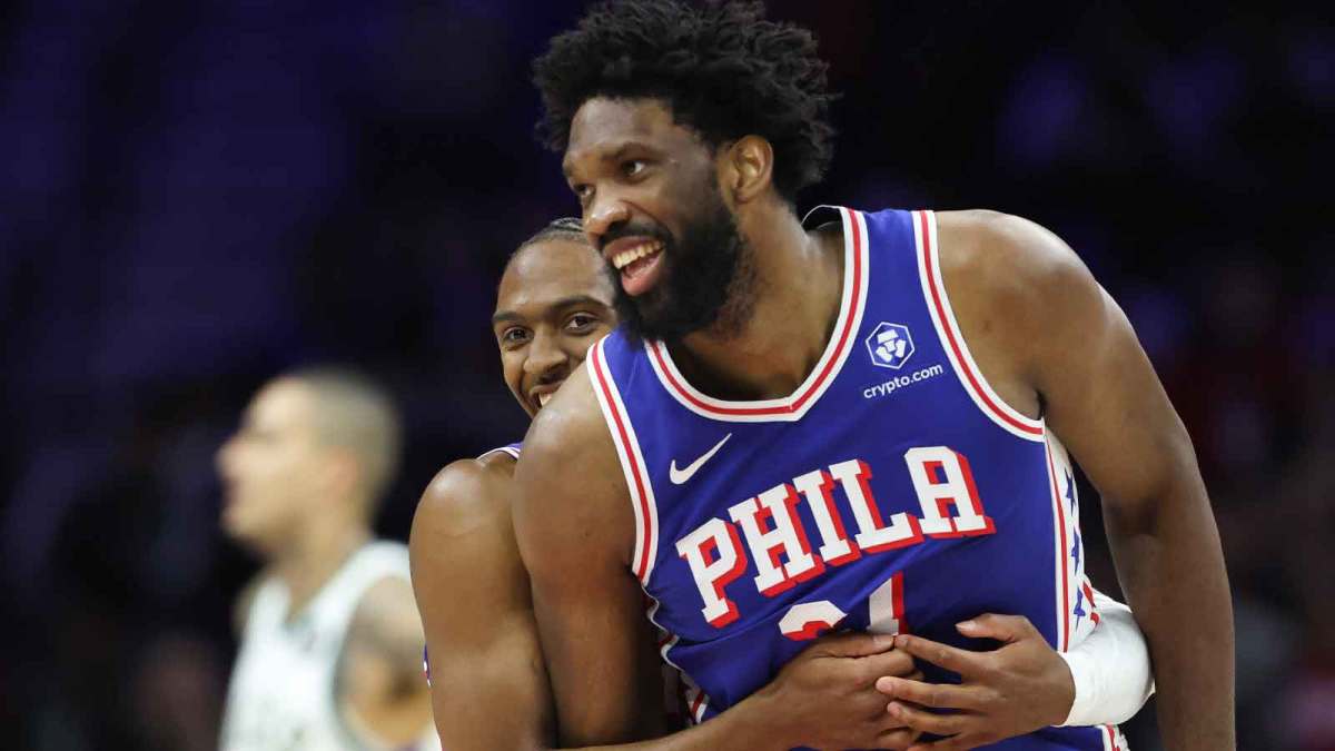 Philadelphia 76ers center Joel Embiid (21) celebrates with guard Tyrese Maxey (0) after their alley oop dunk connection against the Milwaukee Bucks during the second quarter at Xfinity Mobile Arena.