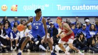 Utah Utes guard Terrence Brown (2) defends BYU Cougars forward AJ Dybantsa (3) during the second half at Marriott Center.