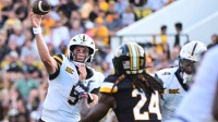 Appalachian State Mountaineers quarterback AJ Swann (5) makes a pass against the Southern Miss Golden Eagles.