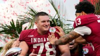 Indiana Hoosiers offensive lineman Pat Coogan (78) celebrates being awarded MVP with Indiana Hoosiers wide receiver Elijah Sarratt (13) on Thursday, Jan. 1, 2026, during the 112th annual Rose Bowl game in Pasadena. Indiana Hoosiers defeated Alabama Crimson Tide, 38-3.