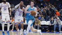 Jan 5, 2026; Oklahoma City, Oklahoma, USA; Charlotte Hornets guard Kon Knueppel (7) drives to the basket past Oklahoma City Thunder guard Aaron Wiggins (21) during the second half at Paycom Center. Mandatory Credit: Alonzo Adams-Imagn Images