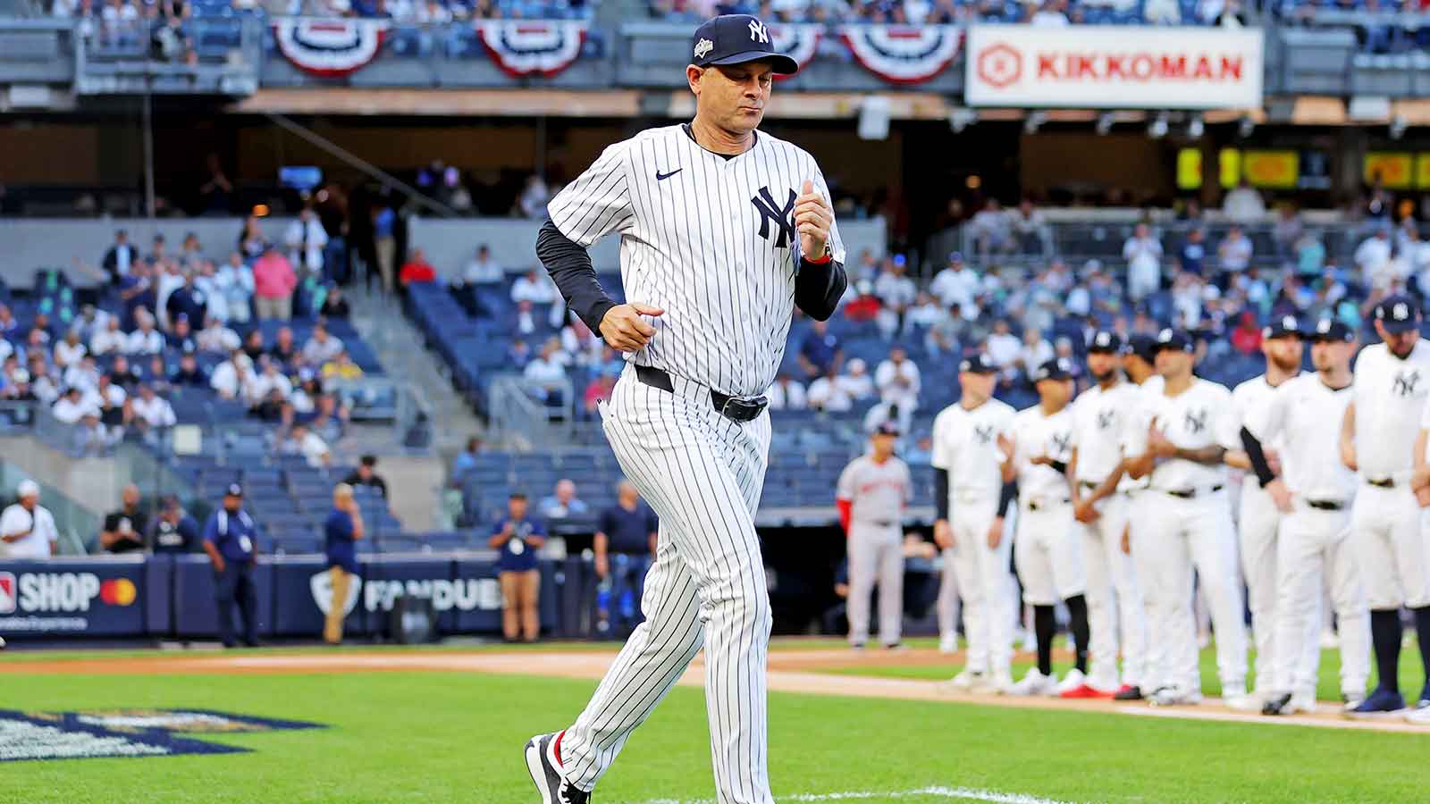 New York Yankees manager Aaron Boone (17) runs on the field before the game against the Boston Red Sox during game one of the Wildcard round for the 2025 MLB playoffs at Yankee Stadium.