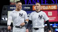 New York Yankees right fielder Aaron Judge (99) talks to left fielder Cody Bellinger (35) after the fifth inning of game two of the Wildcard round of the 2025 MLB playoffs against the Boston Red Sox at Yankee Stadium.
