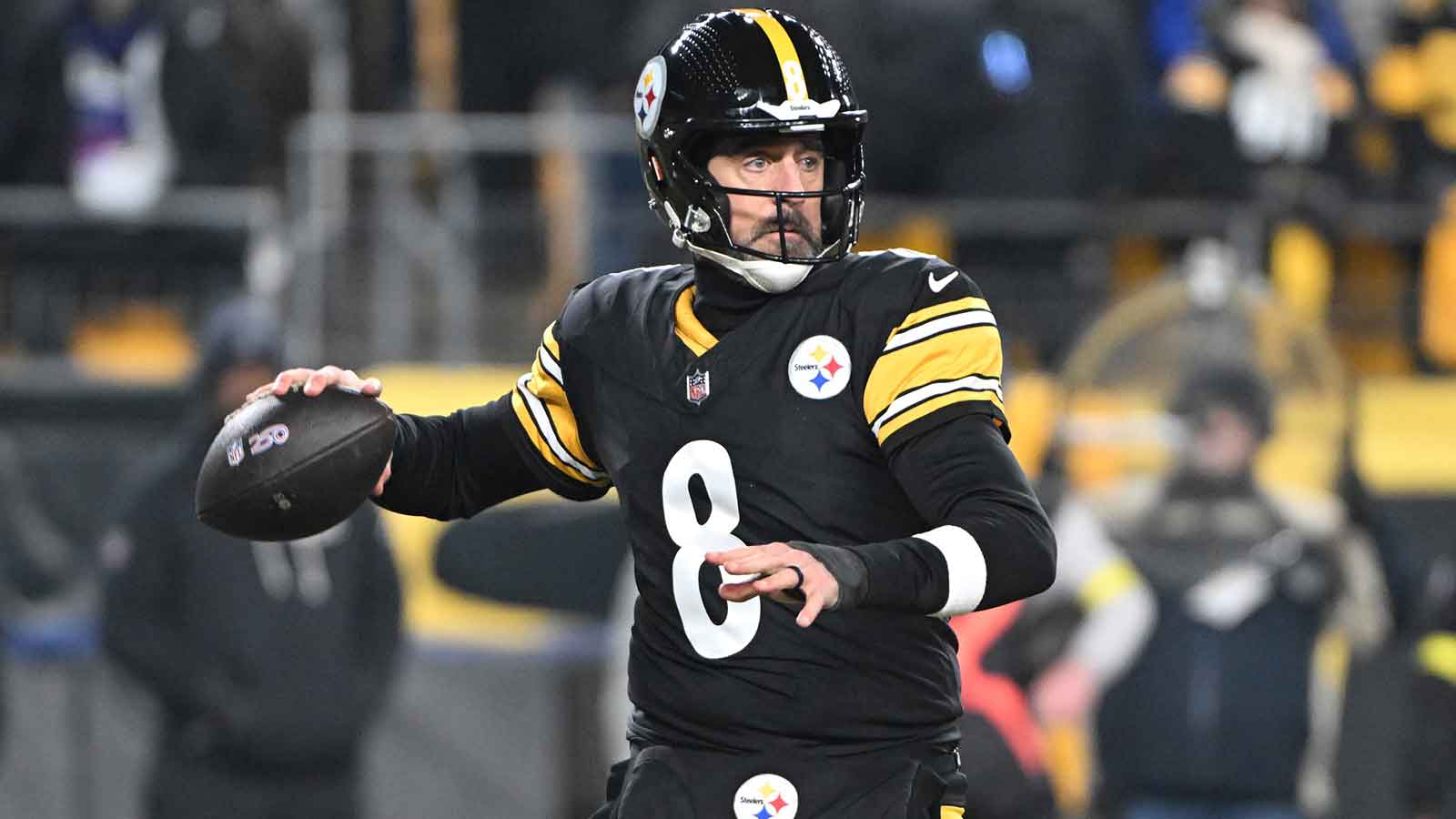 Pittsburgh Steelers quarterback Aaron Rodgers (8) drops back to pass against the Baltimore Ravens during the first half at Acrisure Stadium. 