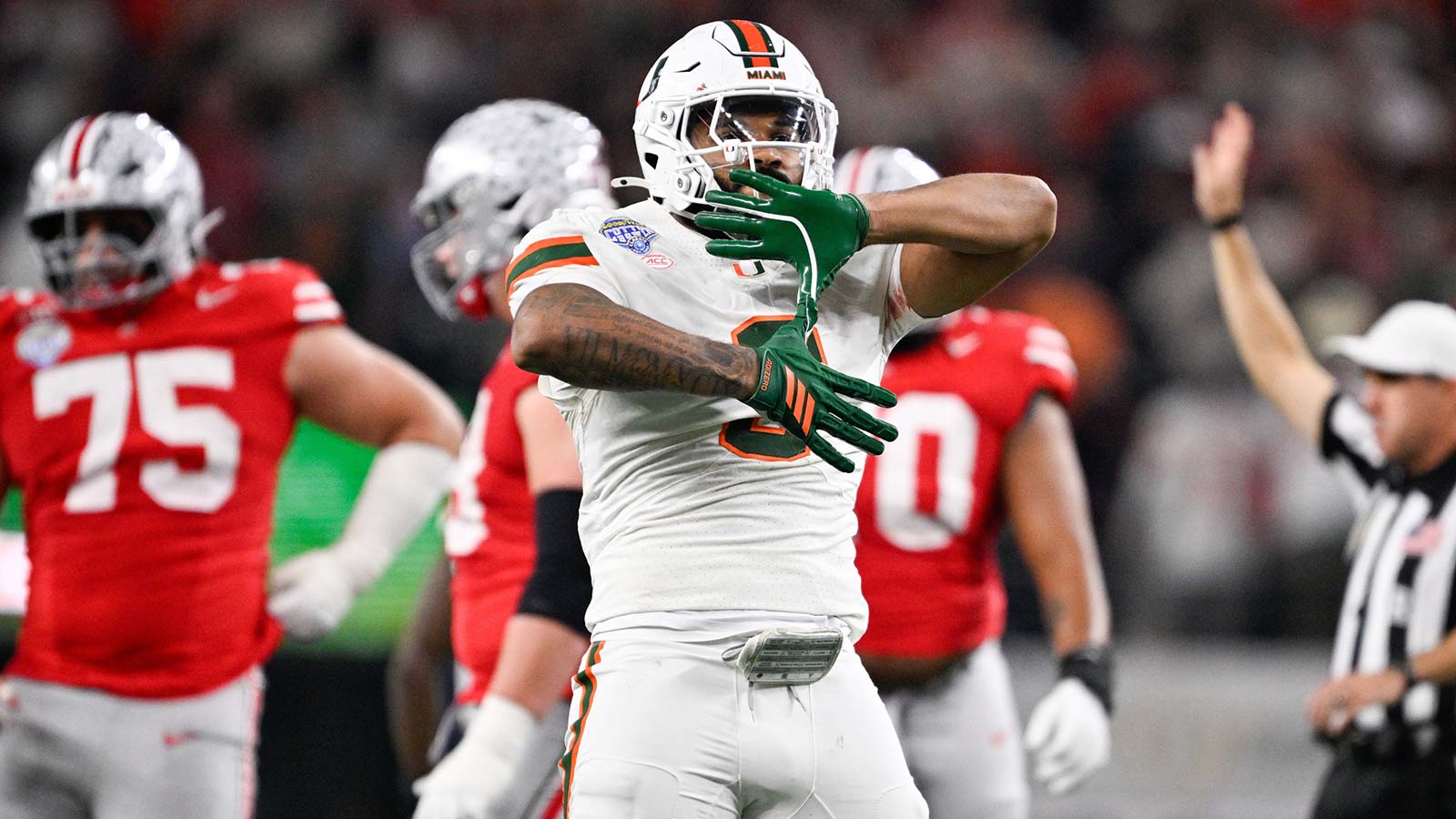 Miami Hurricanes defensive lineman Akheem Mesidor (3) celebrates a sack in the second quarter against the Ohio State Buckeyes during the 2025 Cotton Bowl and quarterfinal game of the College Football Playoff at AT&T Stadium.