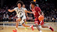 Alabama guard Labaron Philon (0) pushes up the court past Vanderbilt guard Tyler Tanner (3) during the first half at Memorial Gymnasium in Nashville