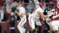 Alabama Crimson Tide quarterback Ty Simpson (15) and offensive lineman Wilkin Formby (75) against the Oklahoma Sooners during the CFP National Playoff First Round at Gaylord Family Oklahoma Memorial Stadium.