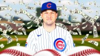 Alex Bregman in a Cubs jersey with cash all around