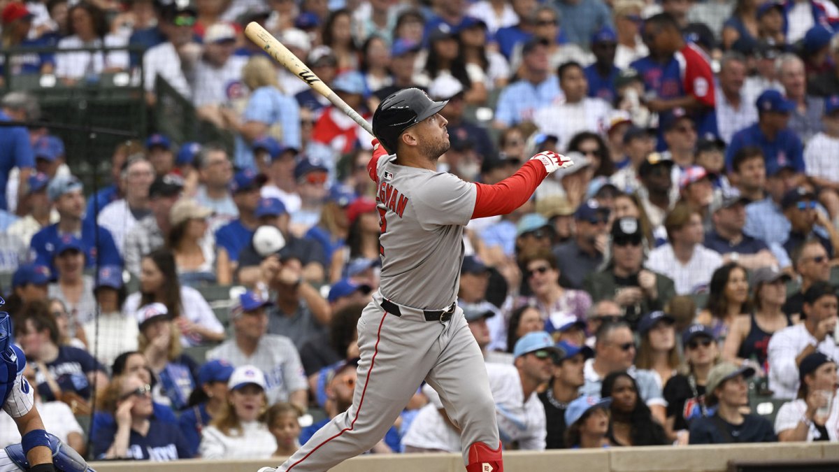 Boston Red Sox third baseman Alex Bregman (2) hits a three run home run against the Chicago Cubs during the eighth inning at Wrigley Field.